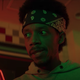 Netflix's Fear Street's Darrell Britt-Gibson wearing a bandana on his head in a pizza parlor.